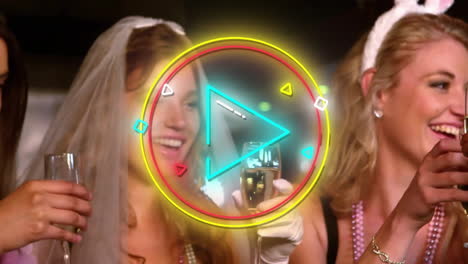 neon play button animation over women celebrating with champagne glasses