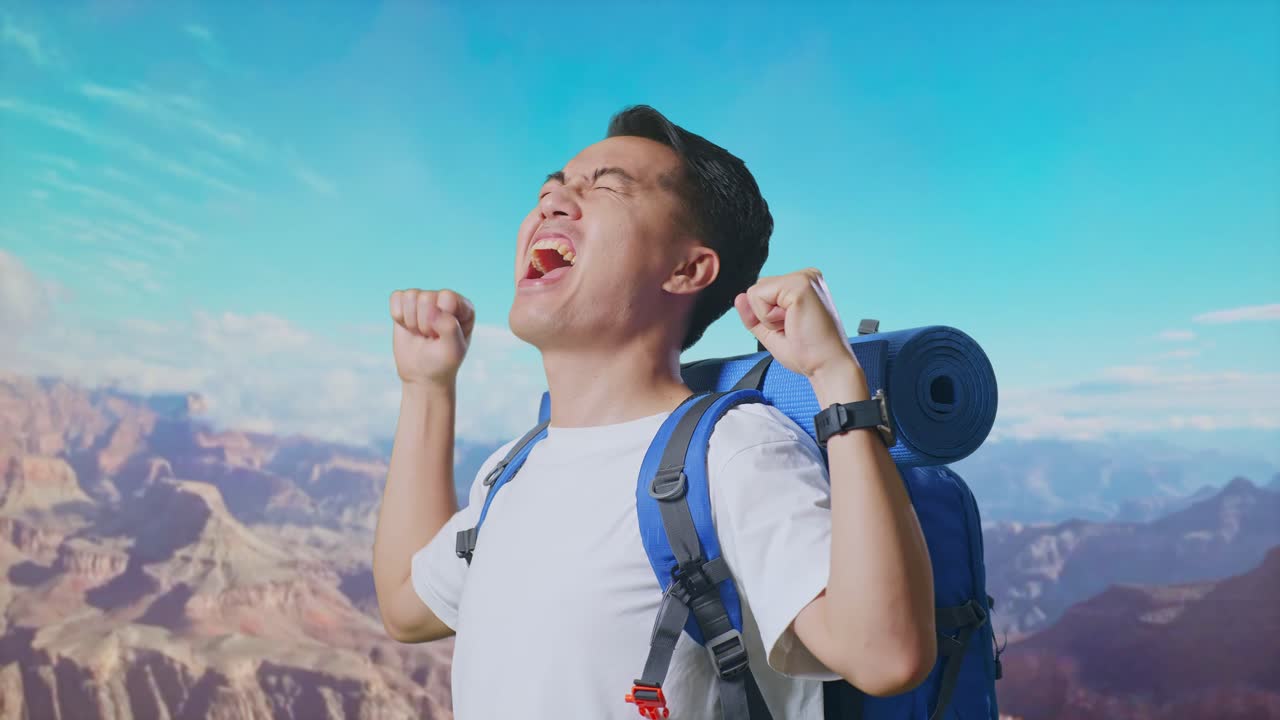 Close Up Side View Of Asian Male Hiker With Mountaineering Backpack Screaming Goal Celebrating The Success While Traveling At The Top Of Mountain