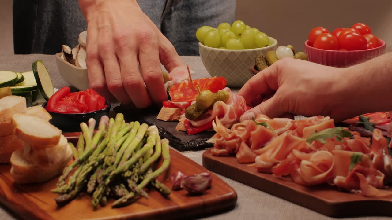 Italian or Spanish restaurant with traditional tapas food, Spanish cuisine, delicious tapas and cheese plate, bruschetta with cheese, olives dry tomatoes and tasty sandwich bar appetizer, buffet