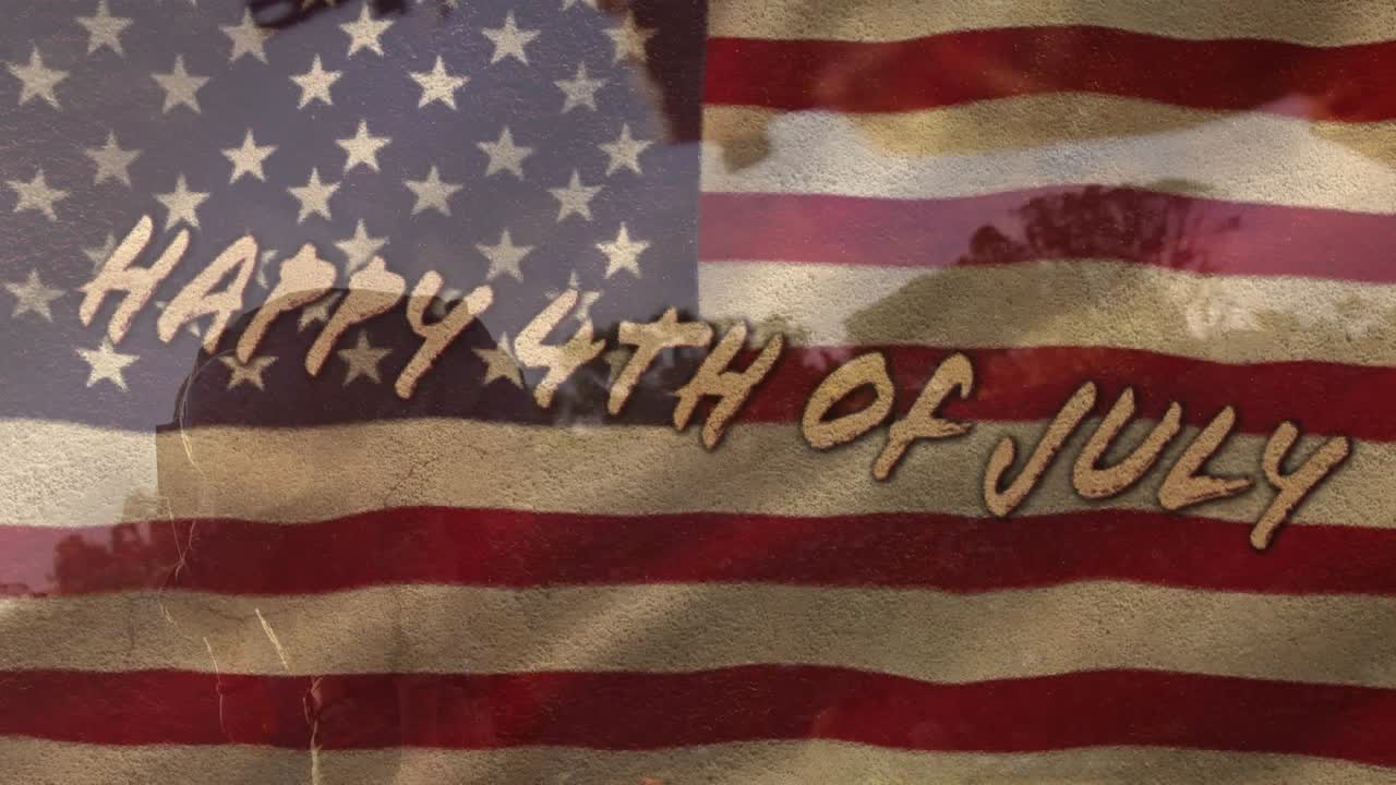 Happy 4th of july text, flag of america, diverse soldier carrying injured subordinate on shoulder