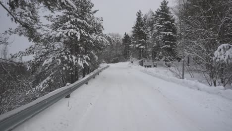 Car-POV-Drive-On-Winter-Mountain-Road-With-Pine-Tree-Forest-Covered-In-Snow