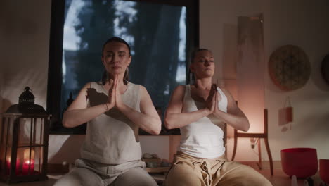 women in a yoga and meditation session