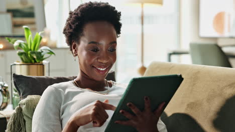 woman relaxing at home with a tablet