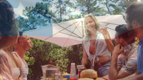 animation of flag of chile waving over diverse friends talking while having drink in get together