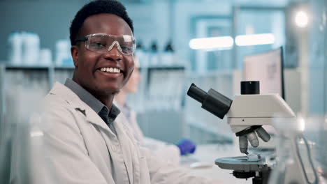 scientist working with a microscope in a laboratory