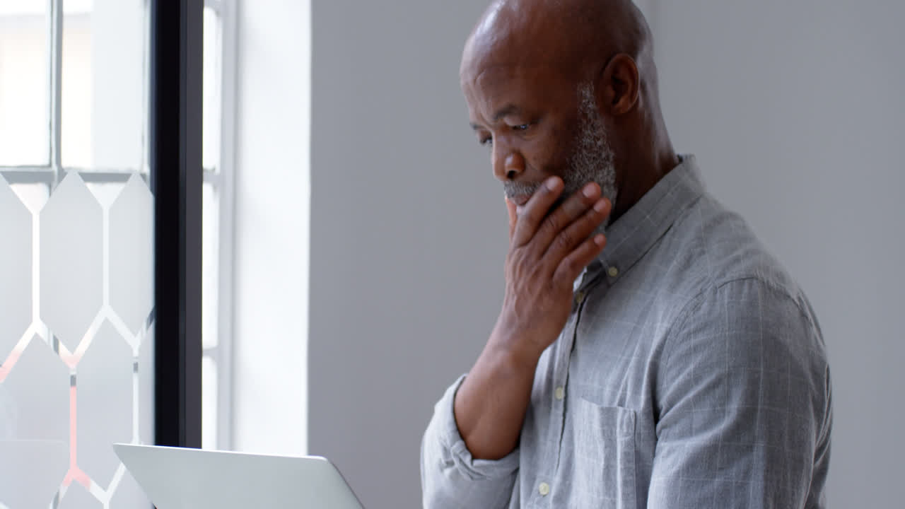 Businessman using laptop at office 4k