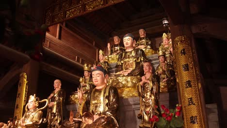 golden statues inside an ancient chinese temple in the mountainous region of ninh ninh in northern vietnam