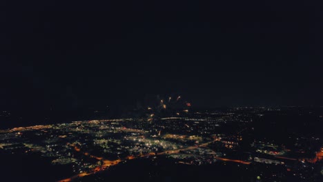 forward-aerial-of-Spectacular-fireworks-4th-of-July-in-Vernon-Hills-Illinois-USA---century-park---with-a-retro-vintage-vibe-color-grading