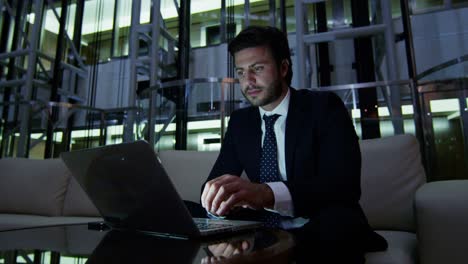 arabic businessman using wifi laptop downtown hotel night