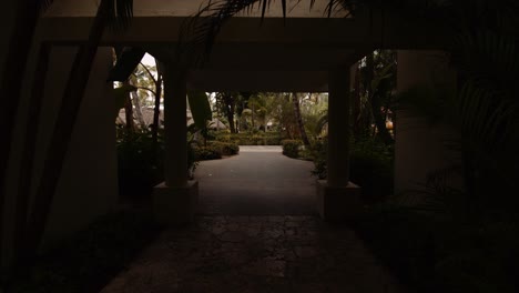 relaxed feeling in caribbean resort with palms and tropical vegetation entering public area from the building