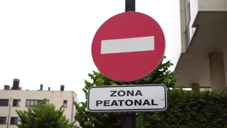 traffic signs entry prohibited and pedestrian area with an inscription in spanish