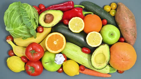 fresh organic fruits and vegetables appear on the table with copy space paper. flat lay stop motion. healthy lifestyle concept