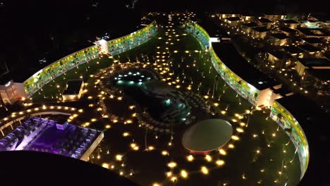 Aerial-View-Over-Temptation-Miches-Resort-Illuminated-With-Lights-At-Night-In-Dominican-Republic---drone-shot