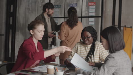 multiethnic female managers doing paperwork