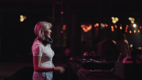 female dj performing at a nightclub