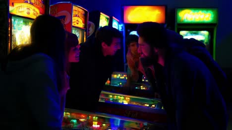 friends enjoying a night at the arcade