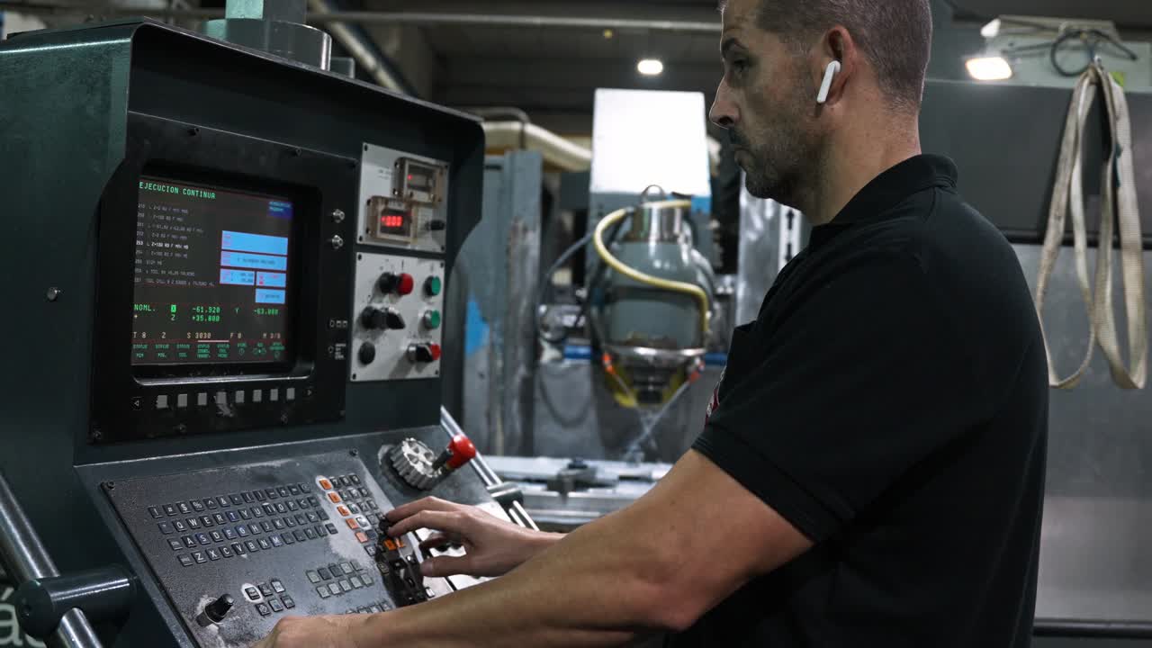 Man Operating CNC Machine