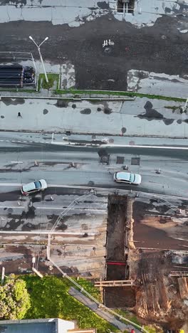 vertical top-down view of purvciems in riga, latvia, with traffic moving through city streets.