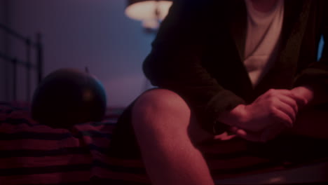 person sitting in bed at night