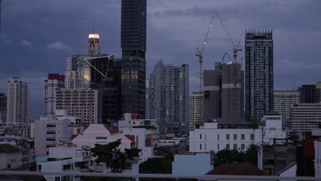 living conditions in bangkok high middle class housing, gritty bangkok skyline at dawn