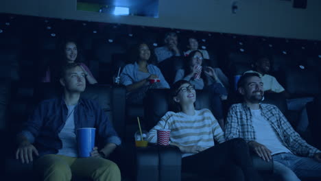 people watching a movie in a cinema
