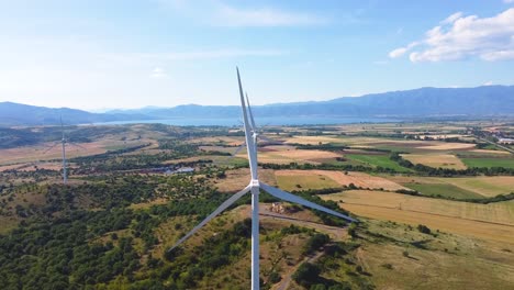 aerial crane shot of wind turbines in doirani kilkis greece, environmental impact of sustainable energy