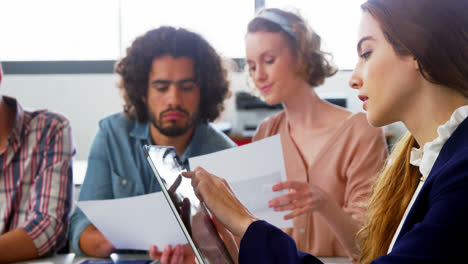 business executive using digital tablet in meeting