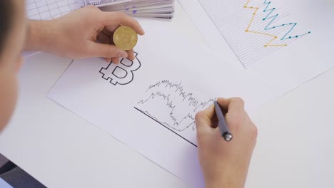 Investor man analyzing bitcoin chart.
