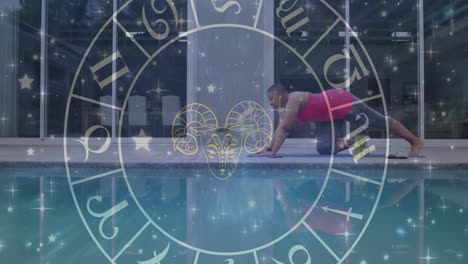 Circle-of-zodiac-signs-over-biracial-women-practicing-yoga