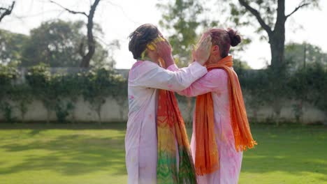 indian friends wishing happy holi to each other