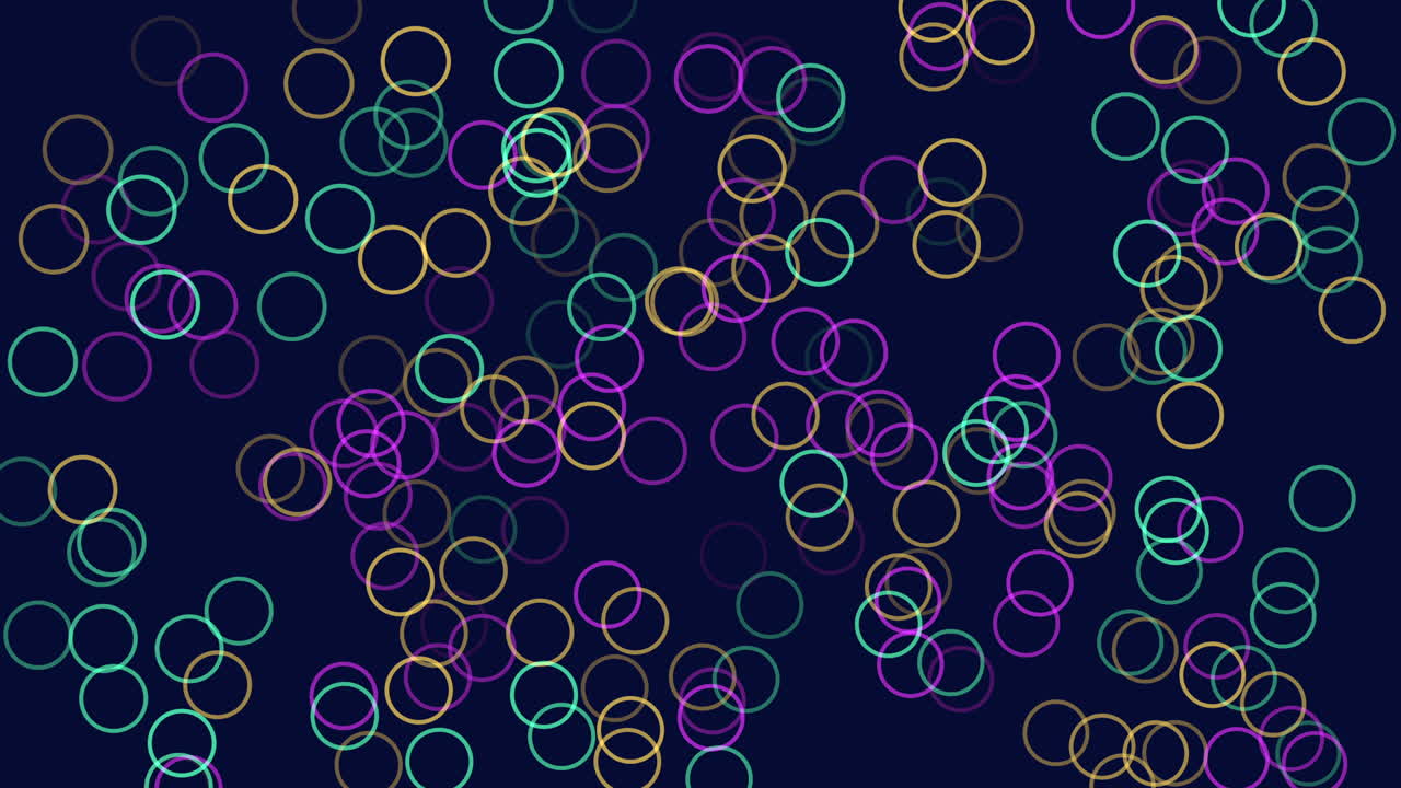 Assorted colorful circles arranged in a symmetrical circular pattern against a dark backdrop give the impression of floating in the air