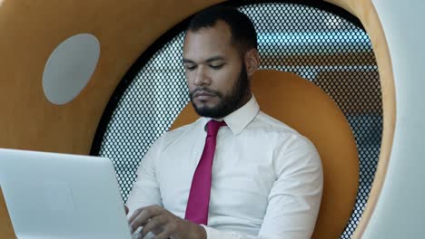 focused businessman using laptop