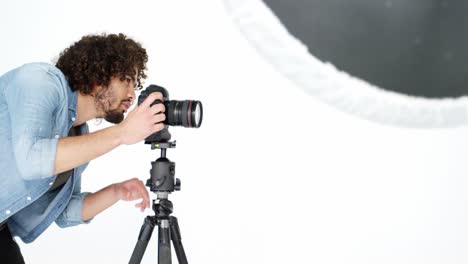 photographer taking photo with professional digital camera