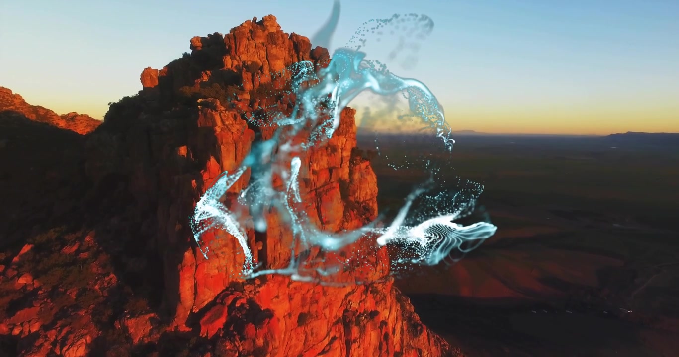 Abstract Glowing Digital Particles Flowing Over Red Rock Mountain
