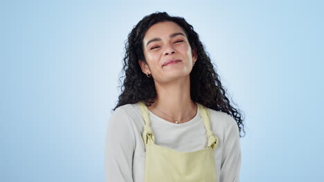 Face-of-woman,-wink-and-laugh-in-studio