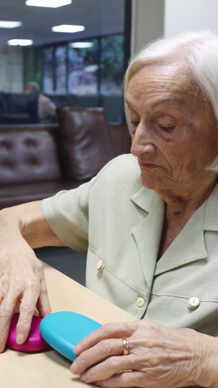 Elderly woman playing a memory game
