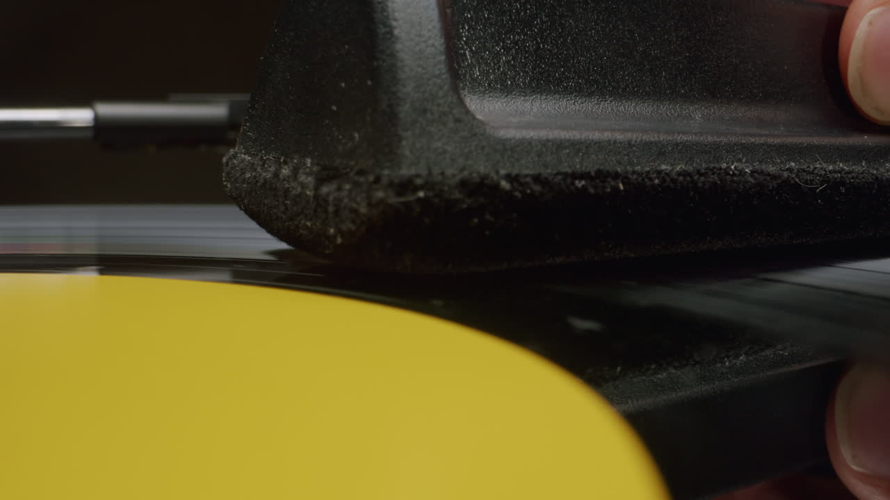 Cleaning a Vinyl Record with a Brush