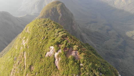 hikers on the summit of the highest rainforest mountain at brazilian south, pico paraná, brazil, south america