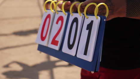 scoreboard in hands