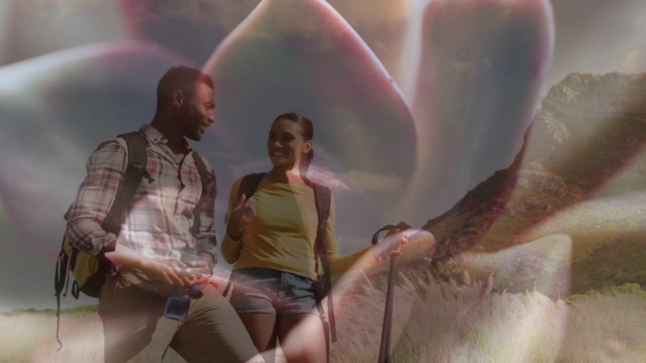 Two hikers checking device and gesturing, preparing to continue on travel trail petals overlaying