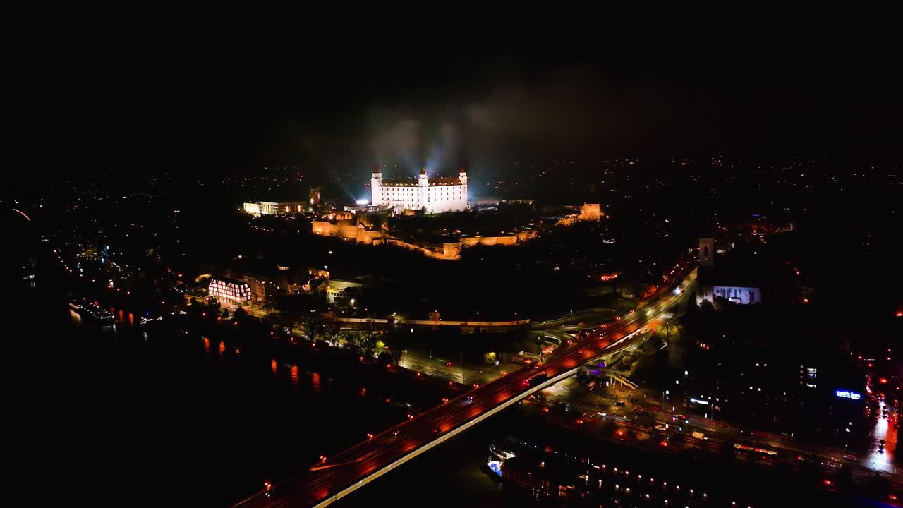 4K cinematic drone shot of Bratislava Castle illuminated at night — Slovakia_028