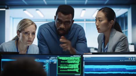 team of professionals analyzing data on computer screens in a modern office environment, collaboration to solve complex problems and enhance project outcomes