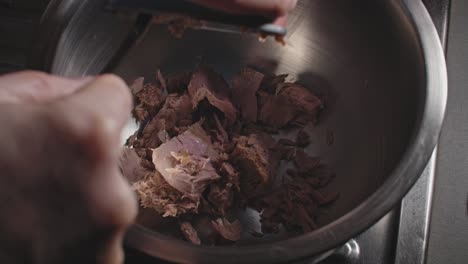 a chef's tuna fritter prep close-up