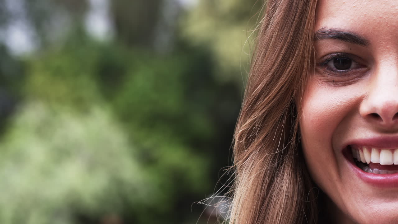 Portrait of smiling woman enjoying outdoor garden, copy space