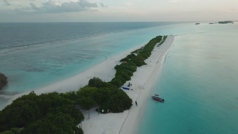 A-Breathtaking-Aerial-View-Of-A-Tropical-Island-With-White-Beach-Sand-And-The-Turquoise-Sea