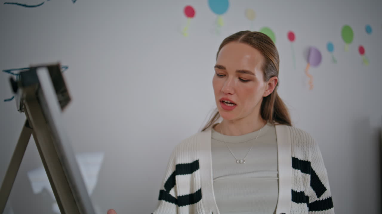 Female schoolteacher writing board classroom closeup. Teacher beginning lesson