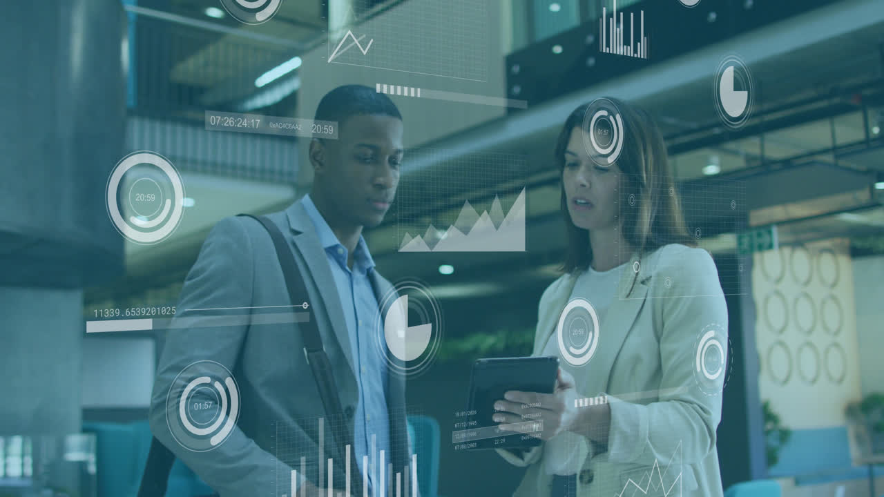 Animation of data processing over diverse businessman and businesswoman discussing over a tablet
