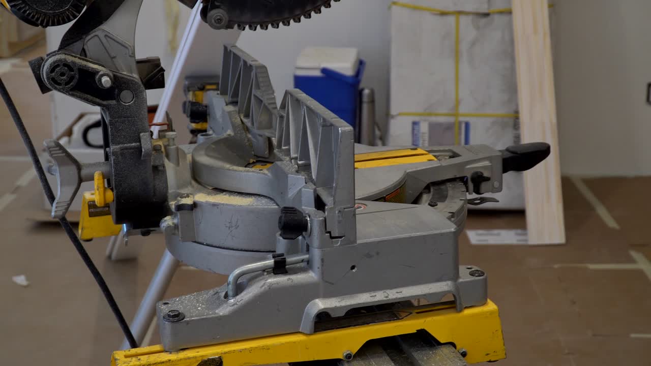 Contractor Using Circular Saw Cutting New Crown Moulding for Renovation.