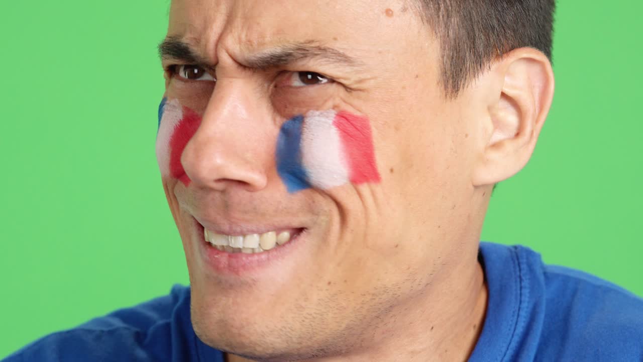 Very nervous man supporting french team during a difficult match