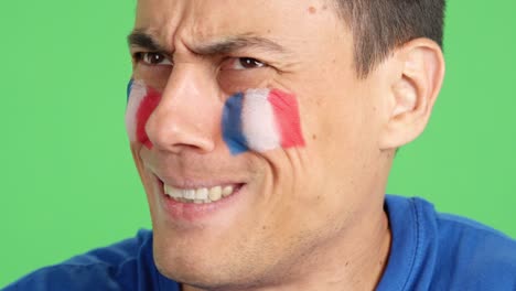 very nervous man supporting french team during a difficult match